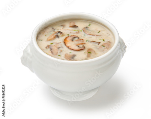  Cream of mushroom soup in a white porcelain tureen isolated on a white background. 