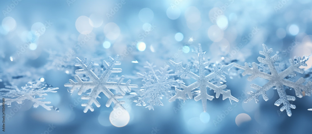 Sparkling Snowflakes on Blue Bokeh Background for Winter Season Sparkling Snowflakes on Blue Bokeh Background for Winter Season