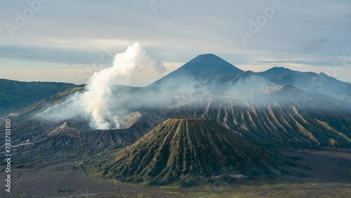 Time lapse of sunrise at smoking active Mount Bromo and Semeru volcano on East-Java, Indonesia photo