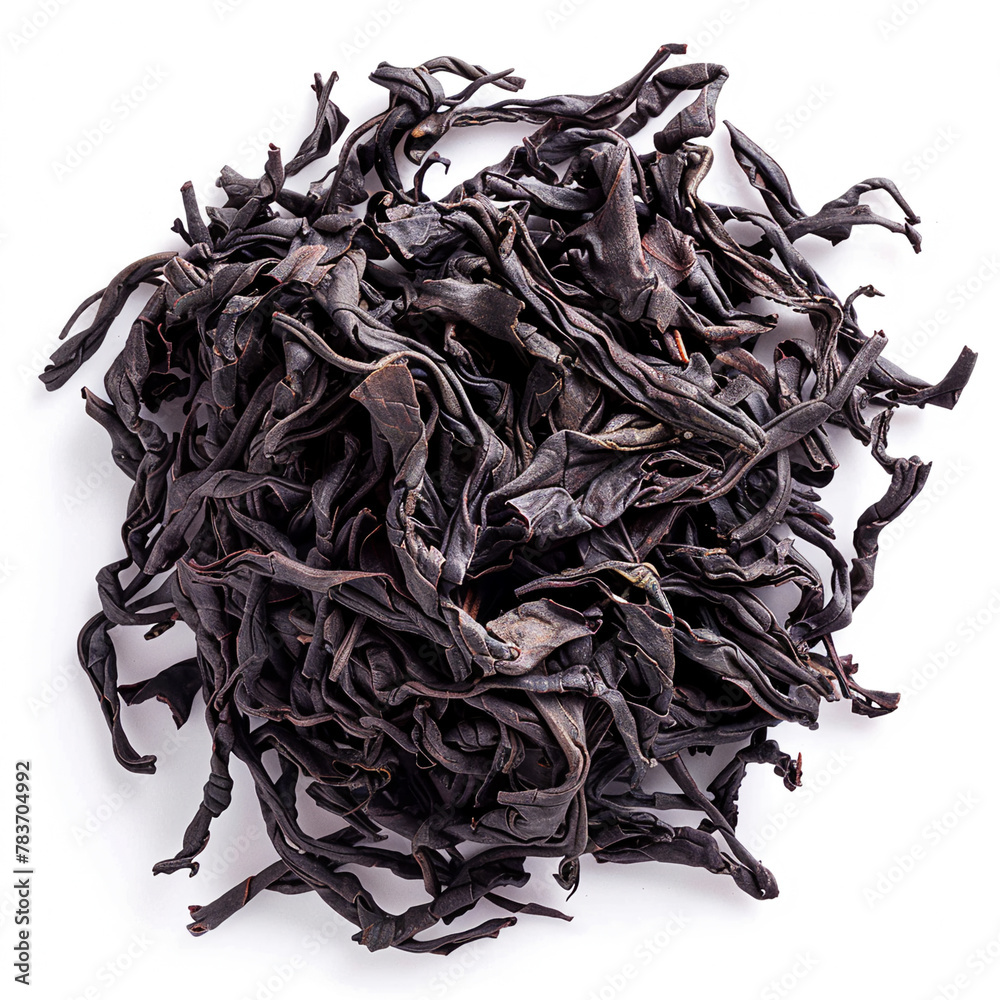 Obraz premium Dry black tea leaves isolated white background