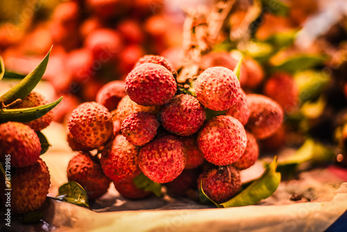 Lychees tied with rubber bands into bunches are sold at fruit markets in Thailand.
