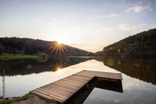 Lake in sunset. Beautiful landscape. Located in the middle of the forest and surrounded by nature, the reservoir offers a great atmosphere. Marbachstausee, Odenwald, Hesse, Germany
