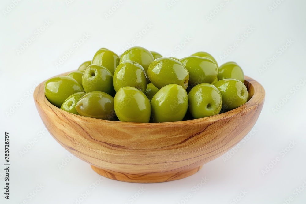Fresh Green Olives In A Wooden Bowl On A White Background Fresh Green Olives In A Wooden Bowl On A White Background