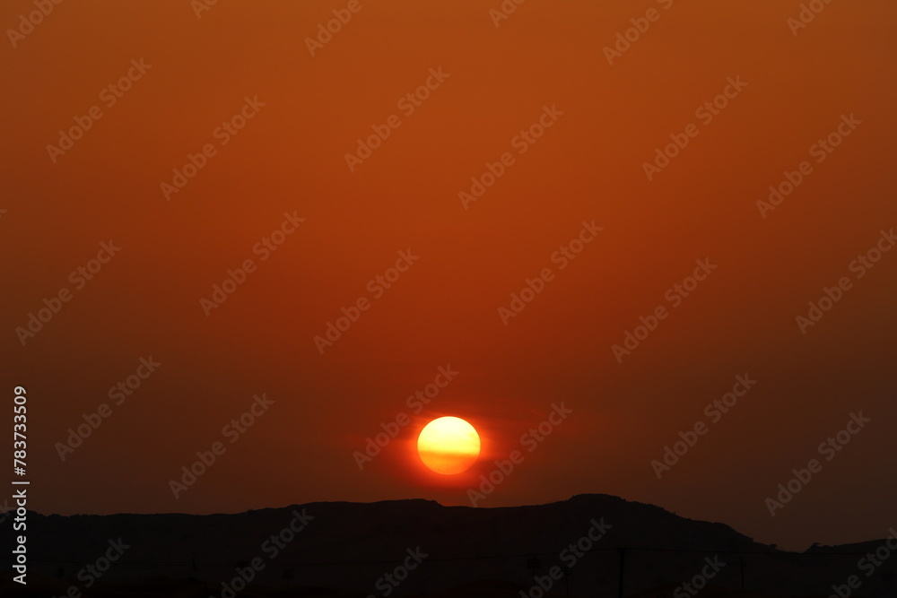 Lighting and color of the sky above the horizon at sunset.