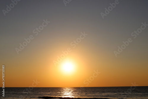 Lighting and color of the sky above the horizon at sunset. © shimon