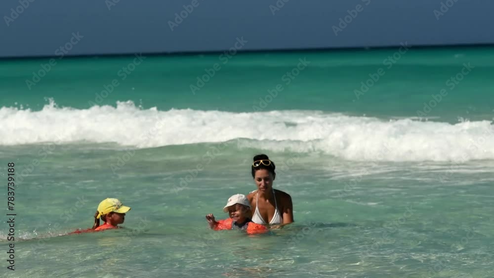 mother with children, playing with kids, family on the beach, swimming in the ocean, vacations in warm countries, Caribbean sea, Atlantic ocean, Cuba, mother with children, playing with kids, family on the beach, swimming in the ocean, vacations in warm countries, Caribbean sea, Atlantic ocean, Cuba,