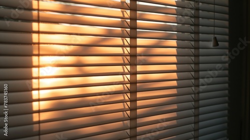 Sunrise or sunset through the blinds.