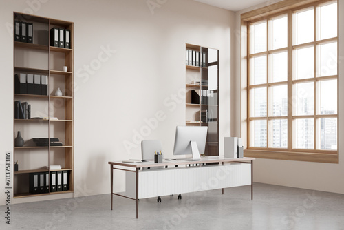 Stylish office interior with workplace, pc computer and window. Mock up wall © ImageFlow
