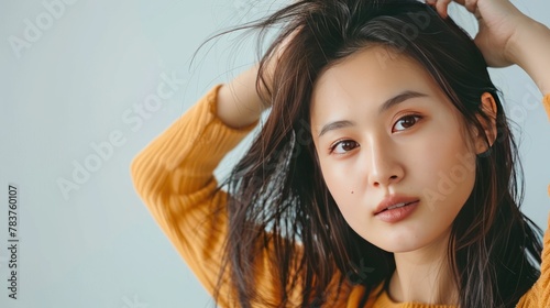 Young asian woman having serious thin hair problem. AI generated © MUCHIB