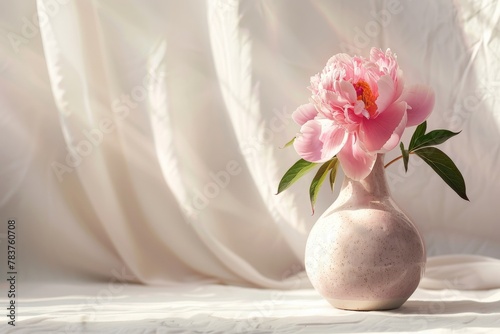White vase with pink flower