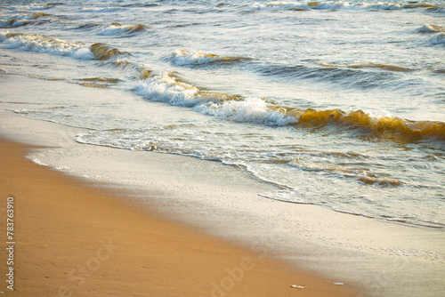 Beach sand and Waves. . The Beautiful Marina Beach, a natural urban beach in Chennai, Tamil Nadu, South India, India, along the Bay of Bengal. the second longest urban beach in the world photo