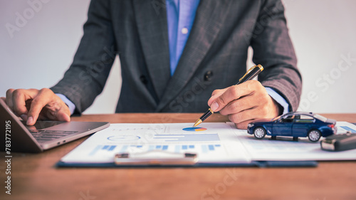 Car dealers facilitate insurance finance agreements, ensuring safety and security for clients. assist in buying, leasing, and selling vehicles, handling paperwork and signatures with professionalism. photo