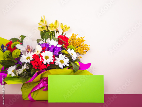 Bouquet of flowers and envelope mock up on white background. Wedding. Mothers Day. Valentine's Day. Birthday. Happy woman's day.