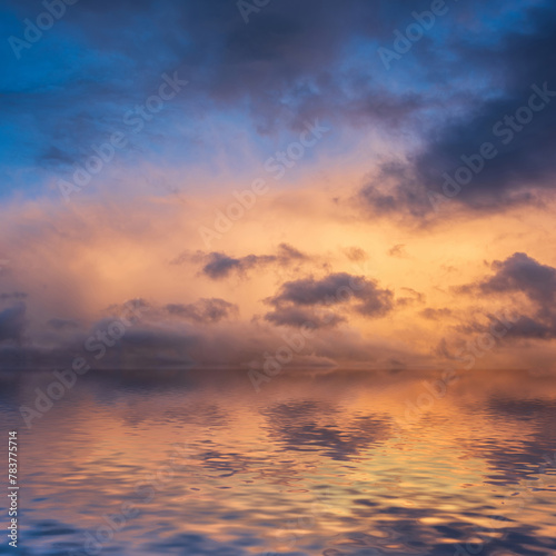 Stunning dramatic colorful stormy landscape sunset sky with lovely moody contrast in the clouds