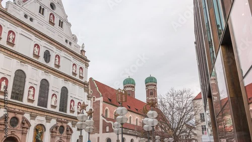 View of the St. Michael's Church and the pedestrian street of Neuhauser in centre of Munich timelapse. Walking street with many shops and relaxing area. Bavaria, Germany. photo