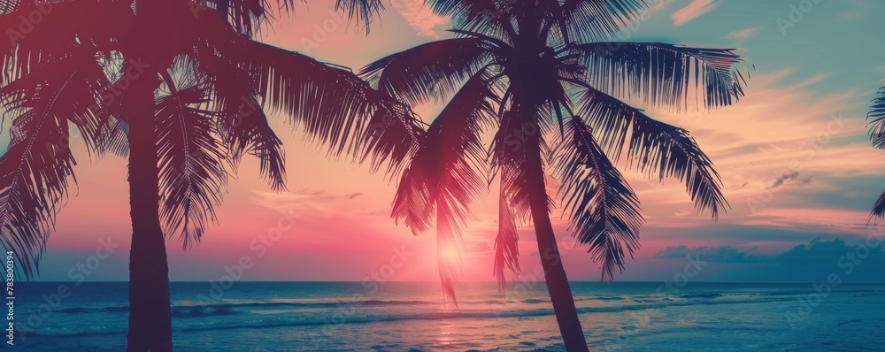 Tropical sunset with silhouetted palm trees