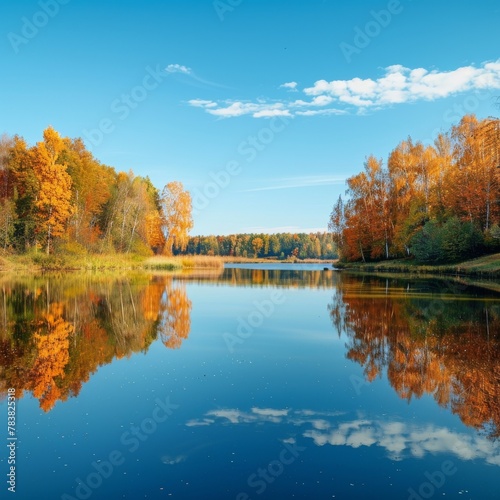 Clear autumn lake reflecting vibrant foliage and sky, highlighting nature's beauty in fall season