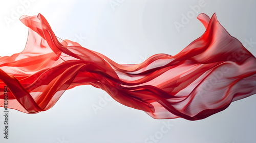 Flying red silk textile flag flag background. Smooth, elegant red satin sways graceful waves folds. isolated gray background. Red curtain.