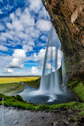 Iceland, Seljalandsfoss, waterfall in the mountains, summer day, long exposure, under the natural wonder