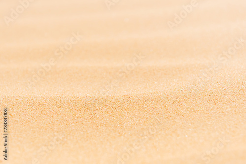 Light yellow sand grain texture. Macro closeup sandy waves. Abstract nature backgrounds and patterns