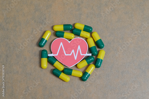 Pill capsules with a heartbeat symbol encapsulate the idea of health-conscious medication, promoting the notion of wellness and vitality with each dose.