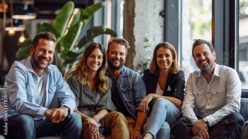 Successful business team smiling and sitting together in the office