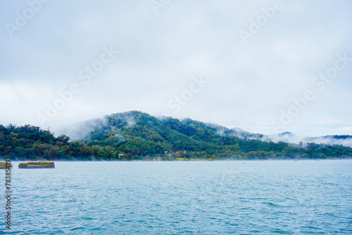 Sun Moon Lake，Nantou, Taiwan, Republic of China, 01 22 2024: The landscape of Sun Moon Lake in a cloudy and foggy day