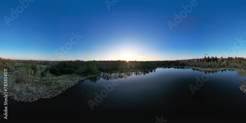 Aerial 360 Panorama of Lake and trees in suburban city.