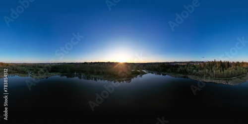 Aerial 360 Panorama of Lake and trees in suburban city.