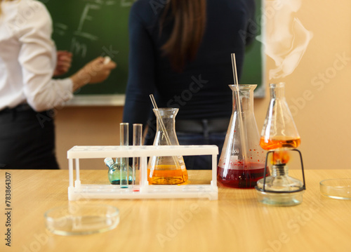 Chemistry laboratory glassware with liquid formula photo