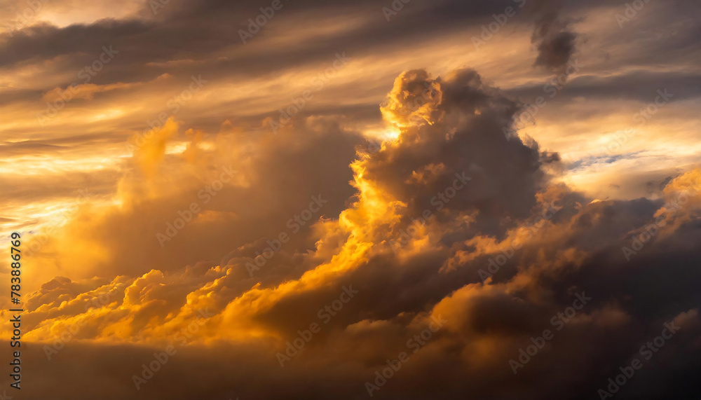 Golden sunlight piercing through dramatic clouds during sunset, creating an ethereal glow.