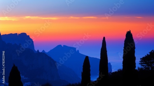 Majestic Mountain Silhouette Against Vibrant Sunset Sky