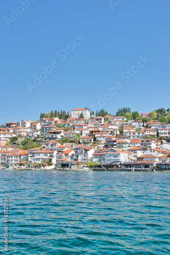 Lake Ohrid, North Macedonia, April 13 2024. Mountain range and peninsula in distance. Ohrid Lake, Macedonia, Europe. The clear mesmerizing waters of lake Ohrid with a beautiful view.   © Scotts Travel Photos