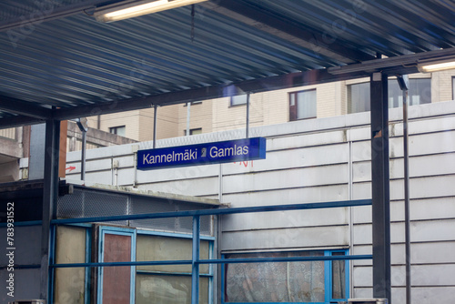 Kannelmäki train station sign. Daylight and blue tones. photo