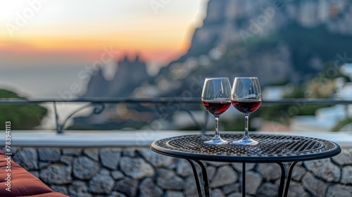 Romantic Sunset Wine Toast with Scenic Cliff View photo