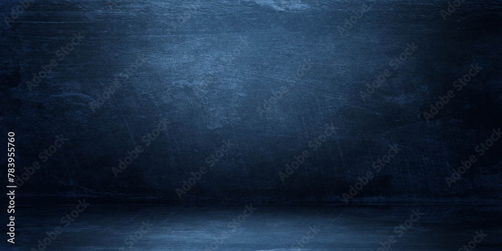 Empty dark concrete wall room studio background and floor perspective with blue soft light well editing displays product and text present on free space cement backdrop Empty dark concrete wall room studio background and floor perspective with blue soft light well editing displays product and text present on free space cement backdrop