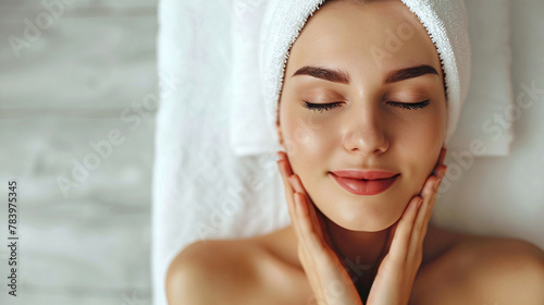 portrait of young beautiful woman in spa environment. Copy space