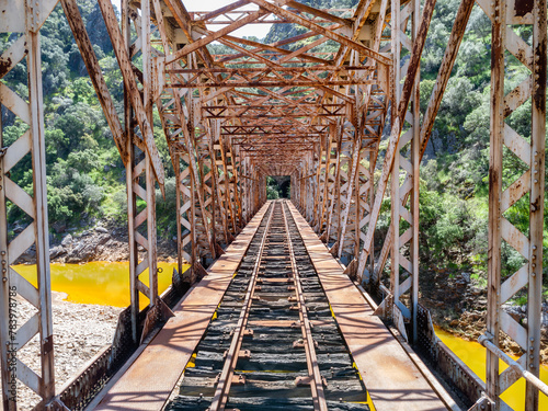 Inside of The Salomon Bridge crossing the red river, Rio Tinto, a railway bridge in the province of Huelva and was originally part of the Riotinto railway for the transportation of copper photo
