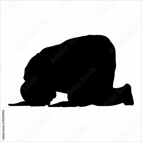 Silhouette of a person prostrating, in prayer