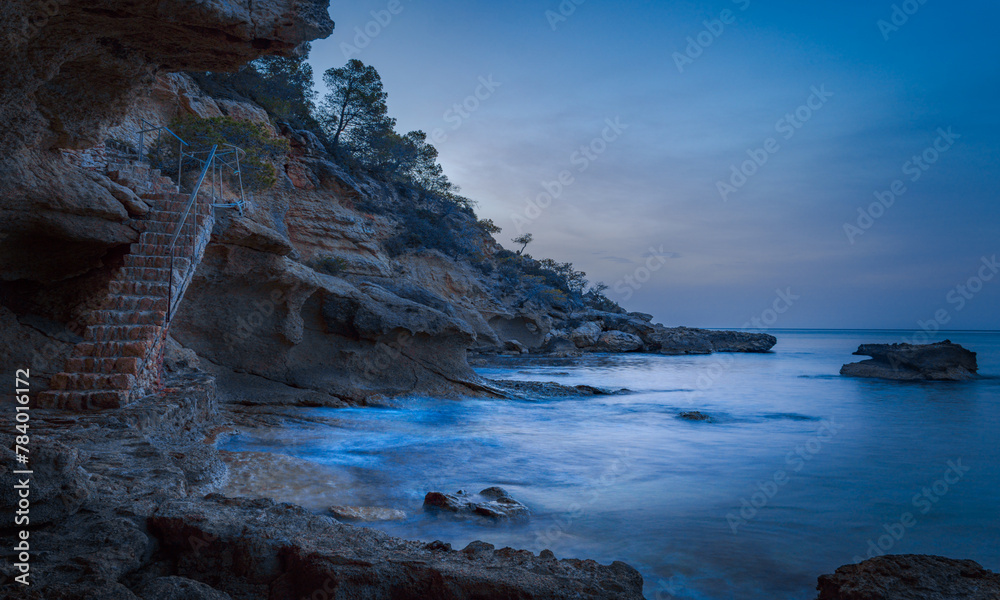 Illot beach L'Ametlla de Mar, Tarragona, Spain.
It is a cove with crystal clear waters and a very beautiful staircase between the rocks