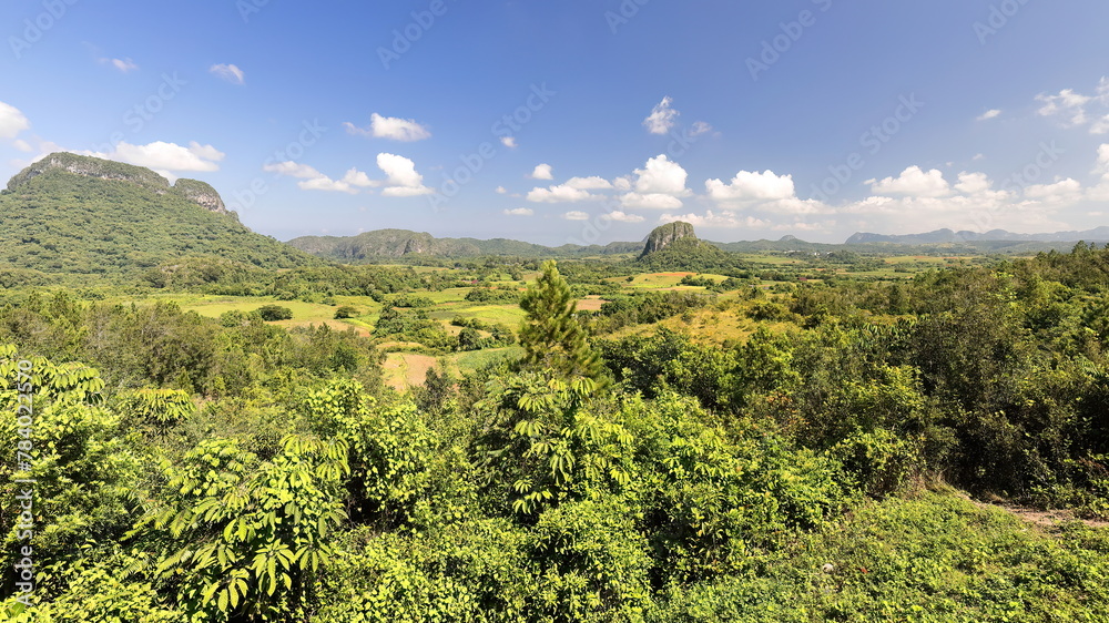 Fototapeta premium Karst landscape with dome-like limestone outcrops -mogote Zecacias, right- and Sierra de la Guasasa -left- in the Valle de Viñales Valley-Cuba-172