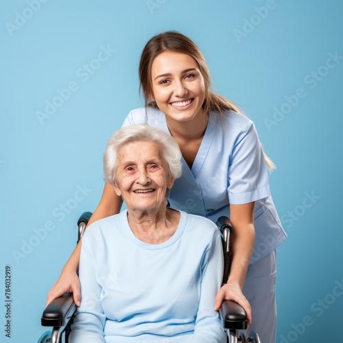 Nursing care of an elderly woman, blue background, close up, copy space