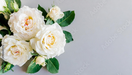 Beautiful bouquet with white and pink roses and petals, top view. Vintage background with flower bouquet and empty space for text. Generative AI © Hulinska Yevheniia