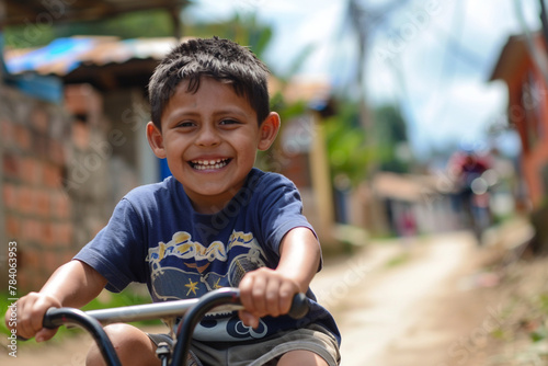 A boy riding a tricycle with a big smile on his face.