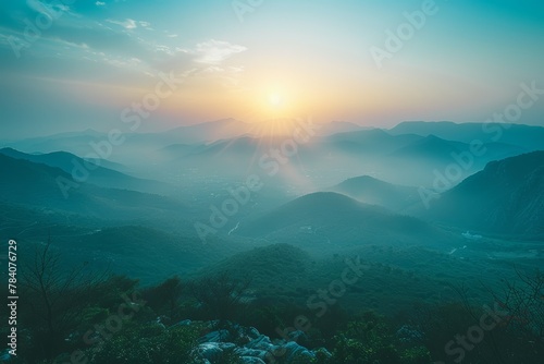 A beautiful mountain range with a bright sun in the sky © top images