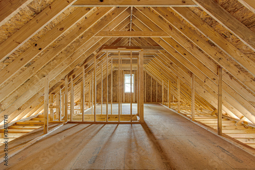 Spacious Attic Under Construction with Exposed Wooden Beams and Framework