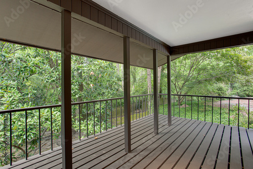Comfortable Covered Screened Porch Overlooking Dense Greenery, Tranquil Outdoor Experience in Summer