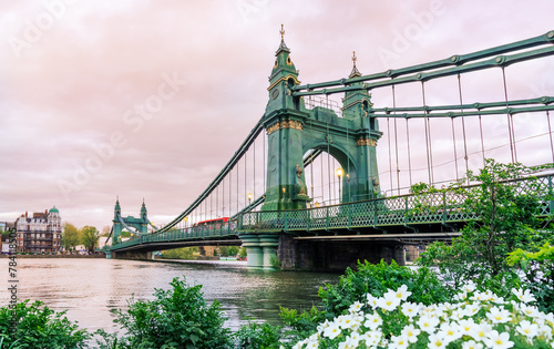 Landscape view of the historical suspension bridge Hammersmith across the River Thames in West London, Great Britain