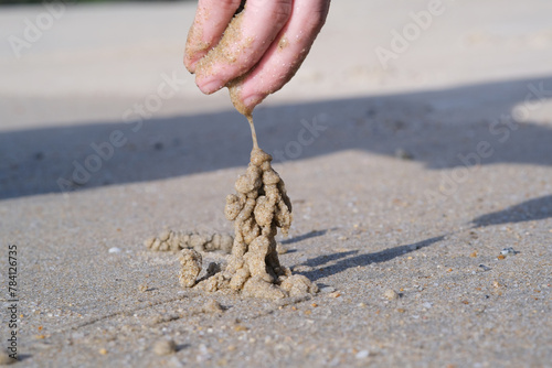 Playing sand tower at the beach