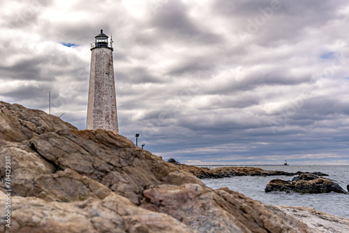 Spring photo of Five Mile Point Lighthouse AKA Old New Haven Harbor Lighthouse, in New Haven, CT, on a cloudy day. photo